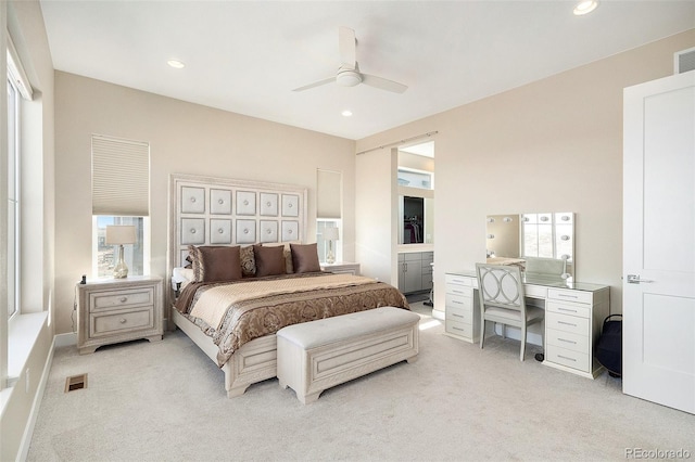 bedroom with light carpet, visible vents, and recessed lighting