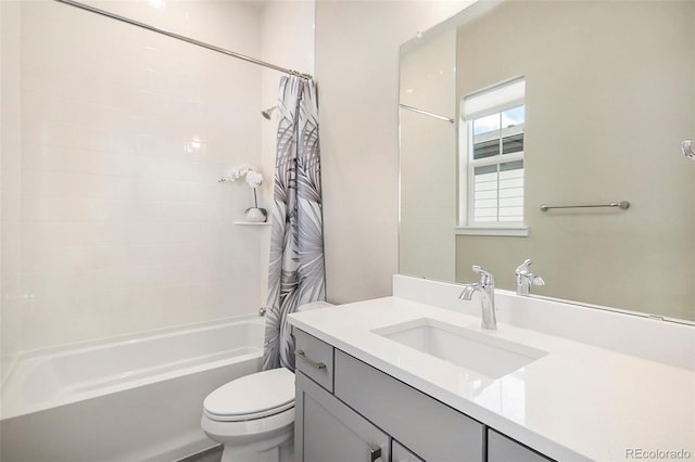 full bathroom with vanity, shower / bath combination with curtain, and toilet