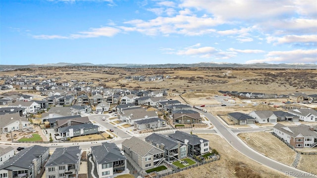 aerial view featuring a mountain view and a residential view