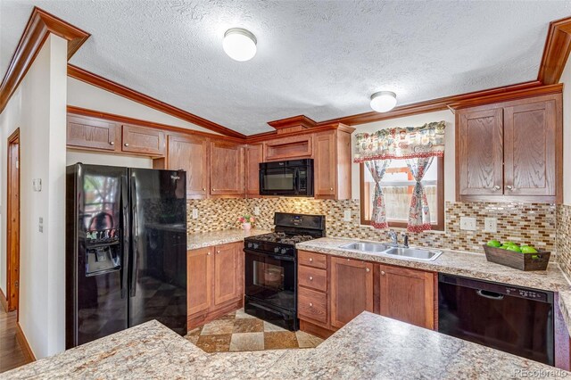 1214 Mac Kay Ct, Dacono, CO 80514 - kitchen with black appliances, vaulted ceiling, decorative backsplash, ornamental molding, and a textured ceiling