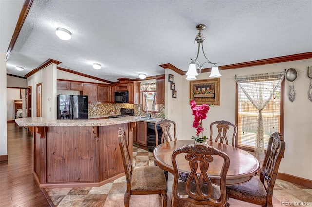 1214 Mac Kay Ct, Dacono, CO 80514 - dining area featuring ornamental molding, a textured ceiling, vaulted ceiling, and light wood-style floors