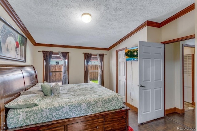 1214 Mac Kay Ct, Dacono, CO 80514 - bedroom featuring dark wood-style flooring, crown molding, and a textured ceiling