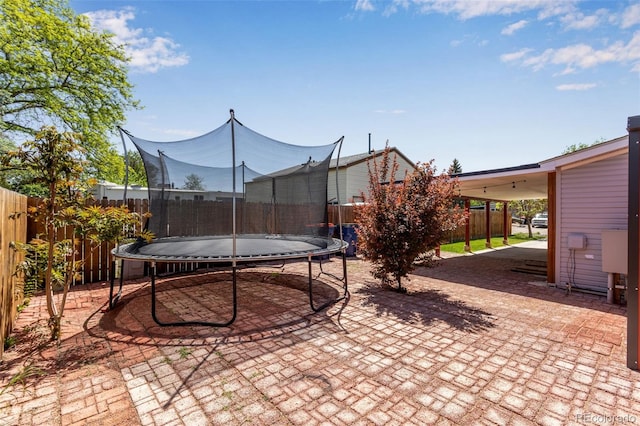 1214 Mac Kay Ct, Dacono, CO 80514 - fenced backyard featuring a trampoline