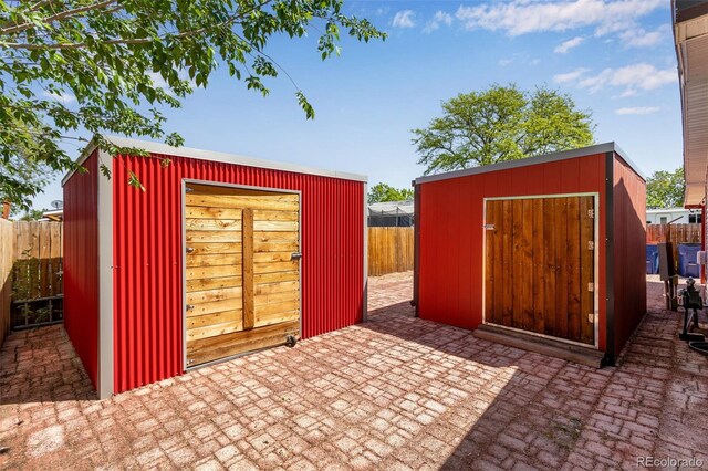 1214 Mac Kay Ct, Dacono, CO 80514 - fenced backyard featuring a storage shed