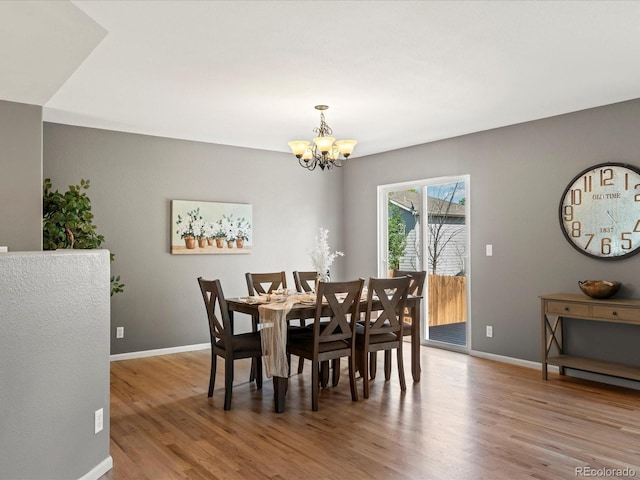 11082 Fillmore Way, Northglenn, CO 80233 - dining space featuring a chandelier and wood finished floors