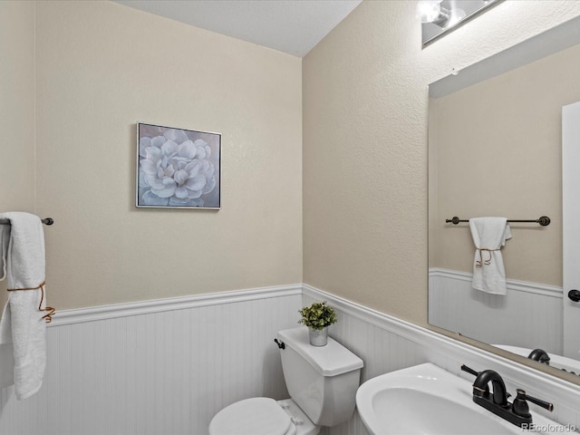 11082 Fillmore Way, Northglenn, CO 80233 - bathroom with a sink and a wainscoted wall