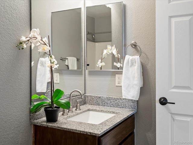 11082 Fillmore Way, Northglenn, CO 80233 - full bath with a textured wall and vanity