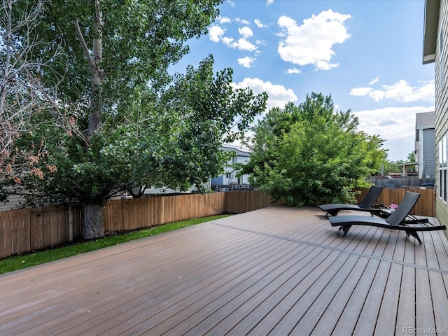 11082 Fillmore Way, Northglenn, CO 80233 - wooden deck with a fenced backyard