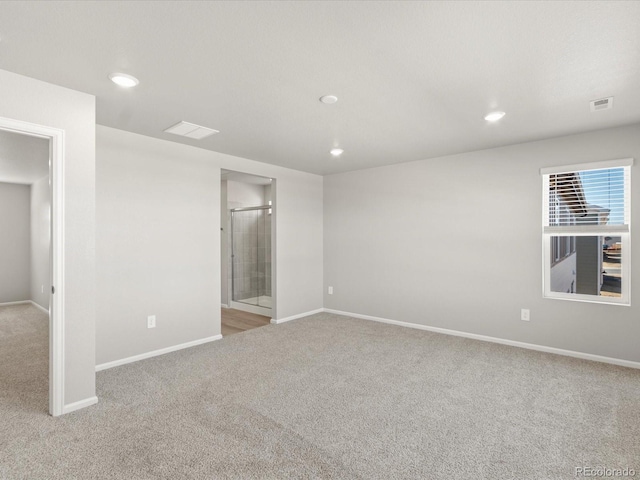 unfurnished room featuring visible vents, recessed lighting, and carpet floors