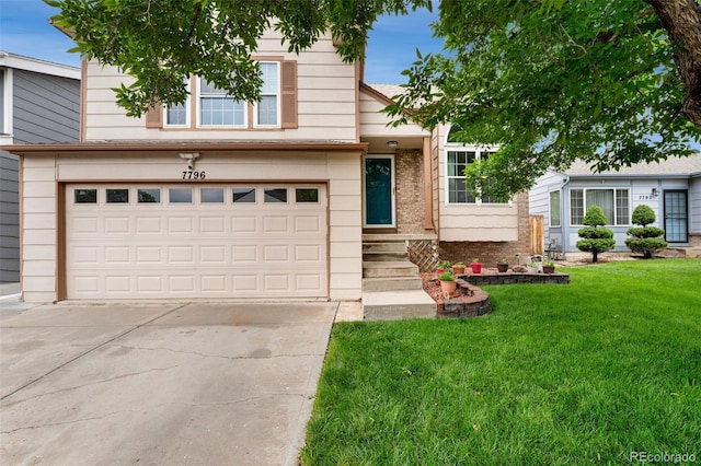 7796 Xavier Ct, Westminster, CO 80030 - view of front of home featuring a front lawn, driveway, an attached garage, and brick siding