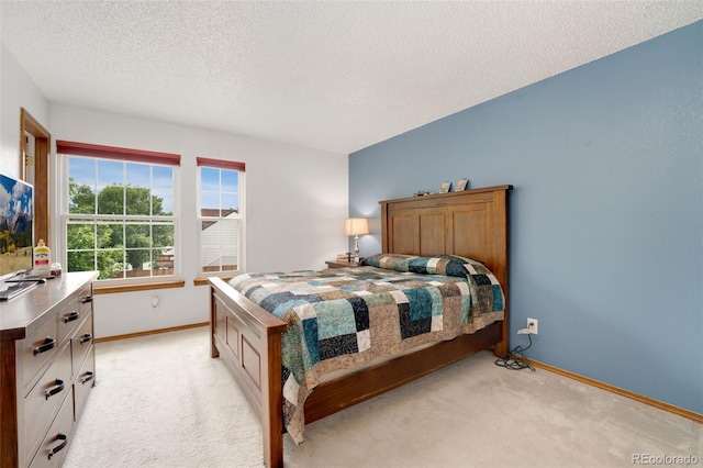 7796 Xavier Ct, Westminster, CO 80030 - bedroom with light carpet, baseboards, and a textured ceiling