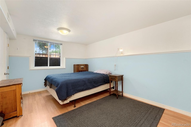 7796 Xavier Ct, Westminster, CO 80030 - bedroom featuring light wood-style flooring and baseboards