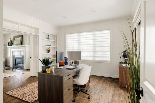 301 Fairfax St, Denver, CO 80220 - office space with built in shelves, dark wood-style flooring, a glass covered fireplace, ornamental molding, and baseboards