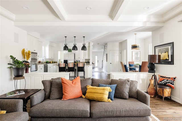 301 Fairfax St, Denver, CO 80220 - living area featuring light wood-style flooring, beam ceiling, baseboards, ornamental molding, and recessed lighting