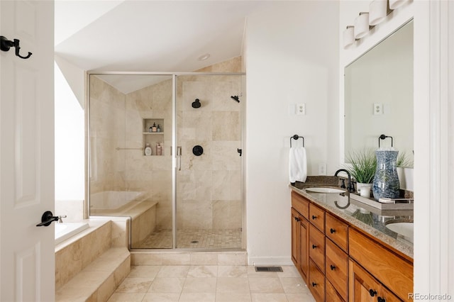 301 Fairfax St, Denver, CO 80220 - full bathroom featuring a stall shower, double vanity, and a relaxing tiled tub