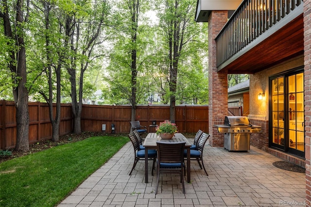 301 Fairfax St, Denver, CO 80220 - view of patio featuring a grill, a balcony, and outdoor dining space