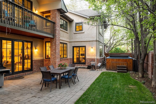 301 Fairfax St, Denver, CO 80220 - rear view of house featuring a hot tub, a balcony, a patio, and stucco siding