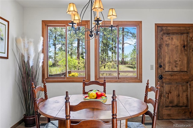 4515 Red Rock Dr, Larkspur, CO 80118 - dining area featuring a chandelier and baseboards