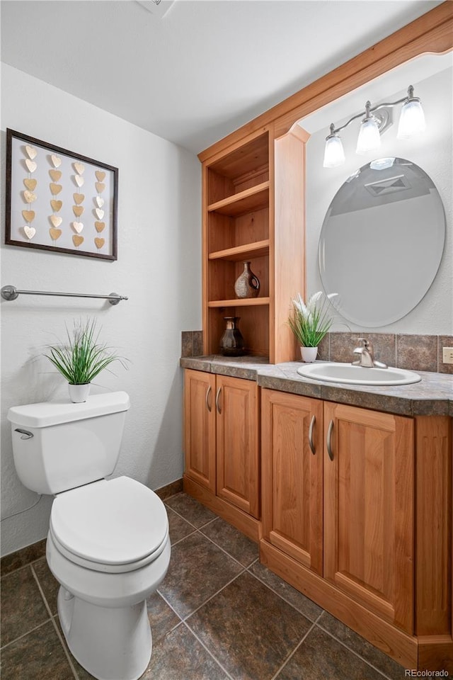 4515 Red Rock Dr, Larkspur, CO 80118 - bathroom featuring toilet, vanity, baseboards, and tile patterned floors