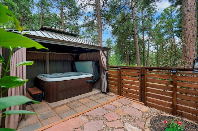 4515 Red Rock Dr, Larkspur, CO 80118 - view of patio / terrace with a hot tub, a gazebo, and a gate