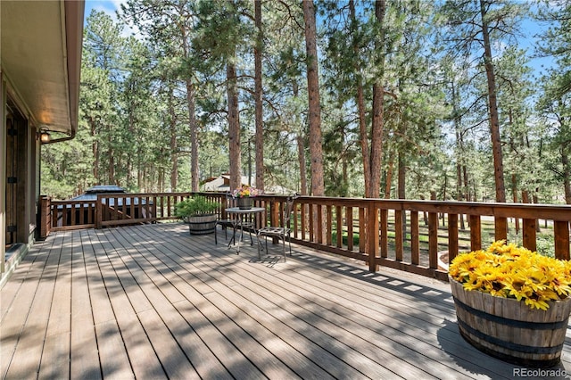 4515 Red Rock Dr, Larkspur, CO 80118 - wooden terrace featuring view of wooded area