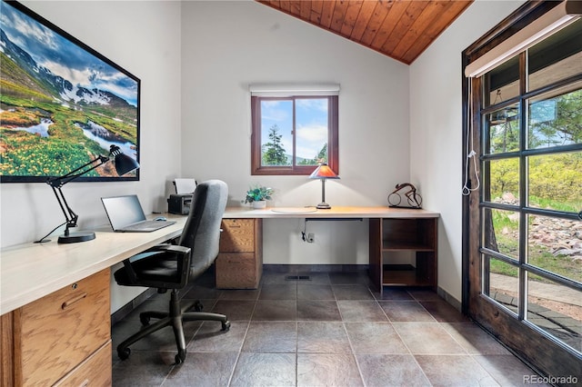 4515 Red Rock Dr, Larkspur, CO 80118 - home office featuring healthy amount of natural light, lofted ceiling, wood ceiling, baseboards, and built in desk
