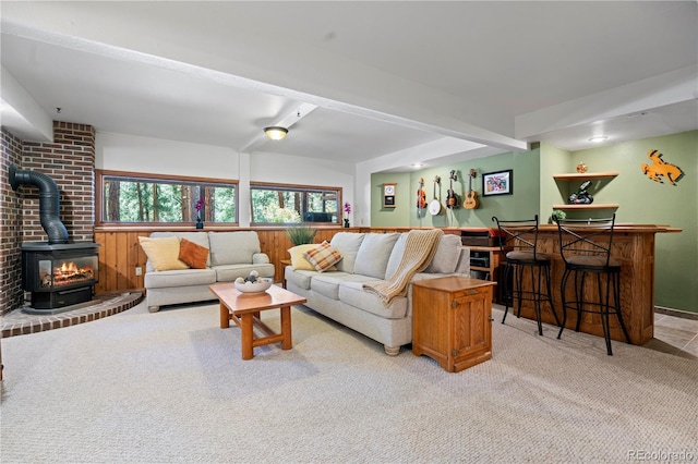 4515 Red Rock Dr, Larkspur, CO 80118 - living room with a wood stove, bar, and light colored carpet