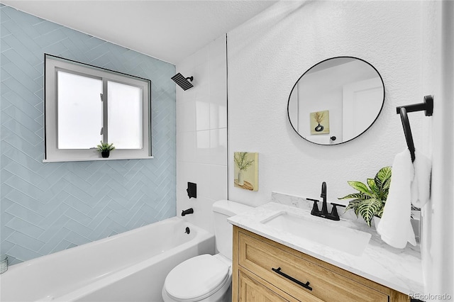 full bathroom with toilet, vanity, and tiled shower / bath combo