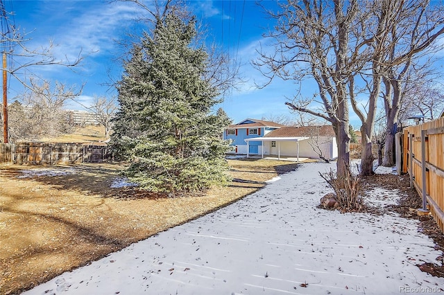 view of yard covered in snow