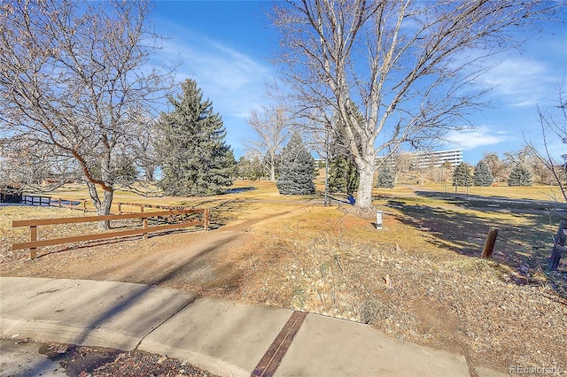 view of yard with a rural view