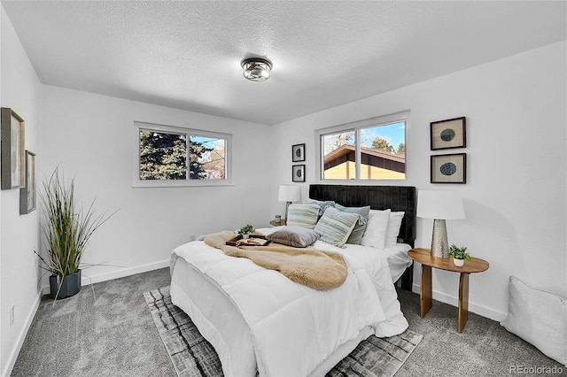 bedroom with carpet and a textured ceiling