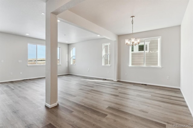 interior space featuring a chandelier and hardwood / wood-style floors