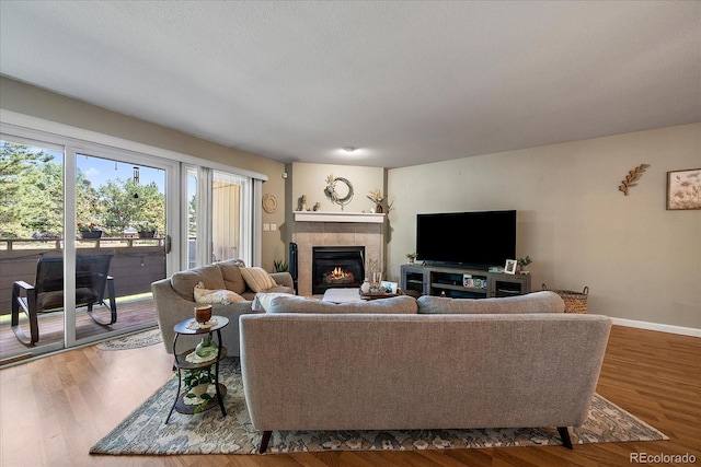 23712 Pondview Pl Unit A, Golden, CO 80401 - living room with a fireplace and wood finished floors