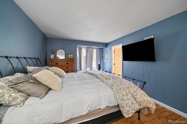 23712 Pondview Pl Unit A, Golden, CO 80401 - bedroom featuring wood finished floors and baseboards