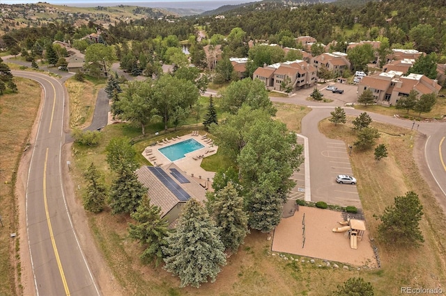 23712 Pondview Pl Unit A, Golden, CO 80401 - view of property location featuring a pool area and a mountainous background