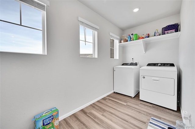 laundry area featuring washing machine and dryer, recessed lighting, light wood finished floors, baseboards, and laundry area