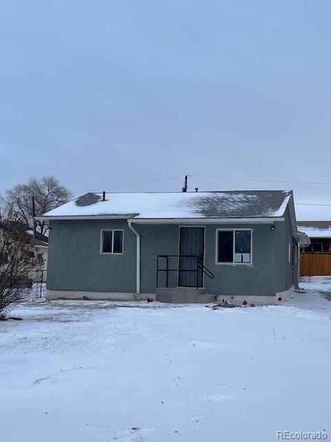 view of snow covered house