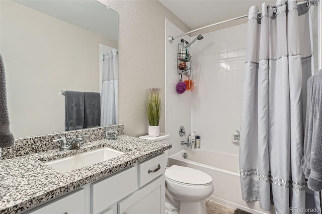 full bathroom with shower / bath combo, toilet, and vanity