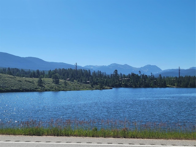 111 Gcr 4421, Grand Lake, CO 80447 - water view featuring a mountainous background and a forest