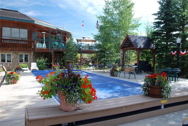 view of pool featuring a patio