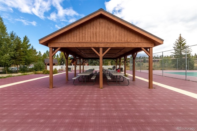 view of home's community with a gazebo and tennis court