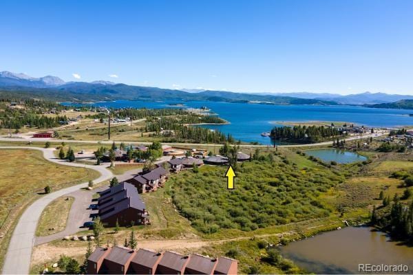 bird's eye view with a water and mountain view