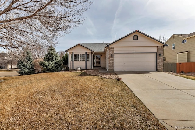 2132 Boise Ct, Longmont, CO 80504 - single story home with an attached garage, concrete driveway, and brick siding