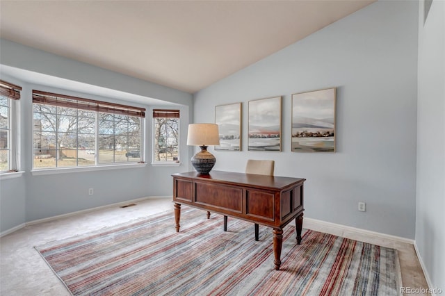 2132 Boise Ct, Longmont, CO 80504 - home office with lofted ceiling, carpet, and baseboards