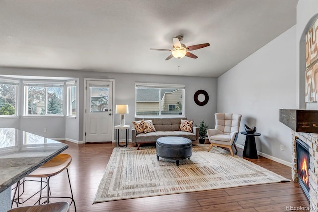 2132 Boise Ct, Longmont, CO 80504 - living room with a ceiling fan, wood finished floors, a fireplace, and baseboards