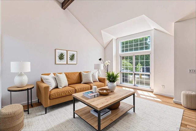9948 King St, Westminster, CO 80031 - living room featuring light wood-type flooring, high vaulted ceiling, and beam ceiling