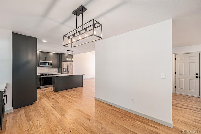 9948 King St, Westminster, CO 80031 - kitchen featuring stainless steel appliances, a chandelier, light countertops, light wood-type flooring, and recessed lighting