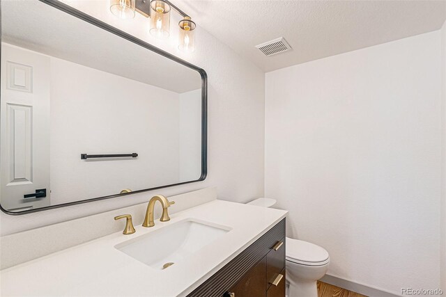 9948 King St, Westminster, CO 80031 - bathroom with vanity and wood finished floors