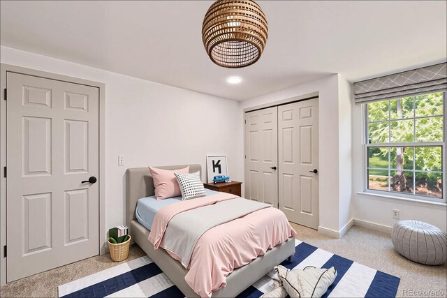 9948 King St, Westminster, CO 80031 - bedroom featuring a closet and light carpet