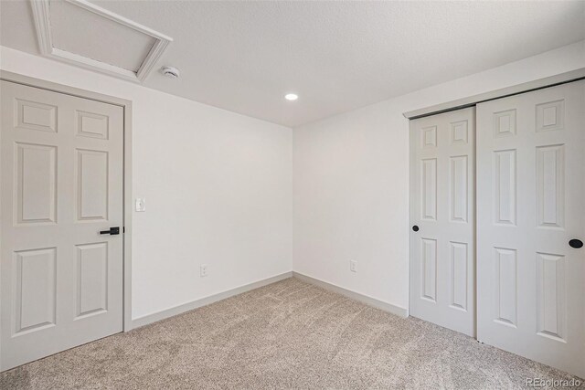 9948 King St, Westminster, CO 80031 - unfurnished bedroom featuring carpet, attic access, recessed lighting, and a closet